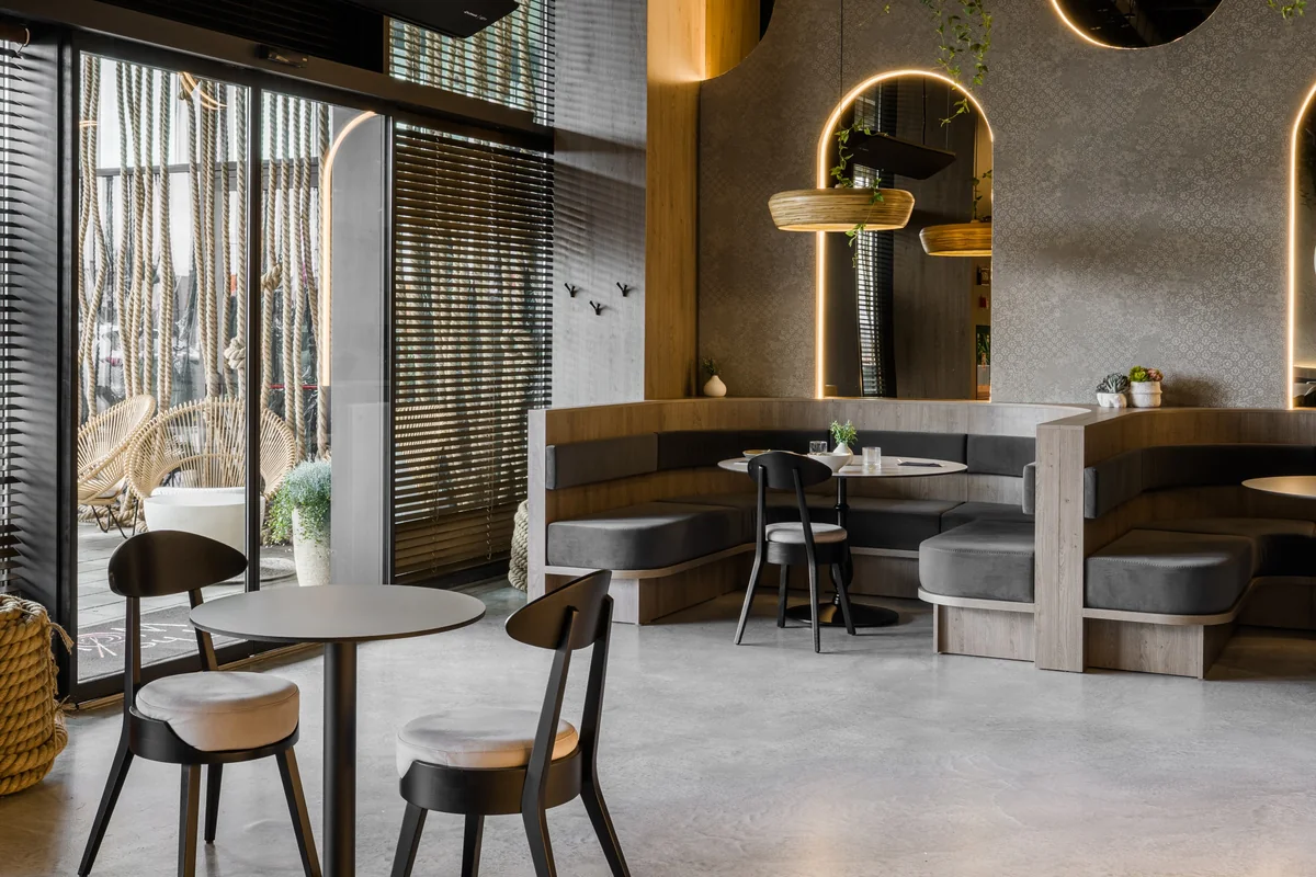 The Wok — daylight across the dining area and curved banquettes